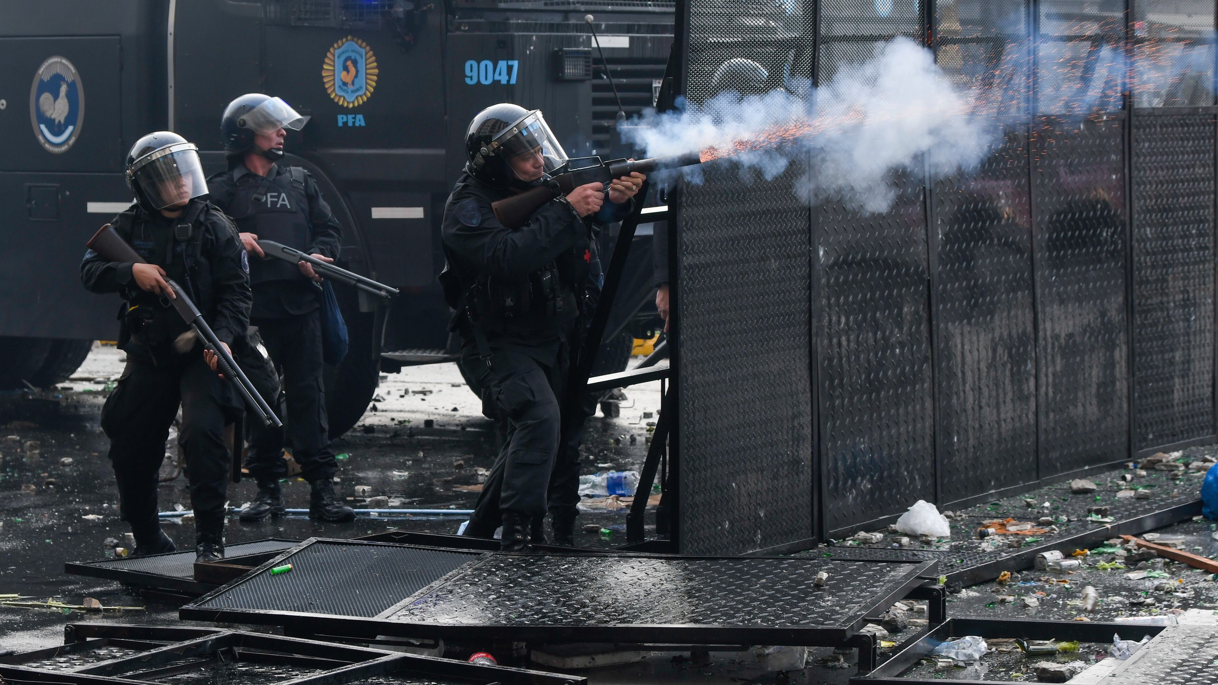 Police launch gas during clashes with anti-government protesters outside Congress, where politicians debate a reform bill promoted by Argentine President Javier Milei in Buenos Aires (Gustavo Garello/AP)