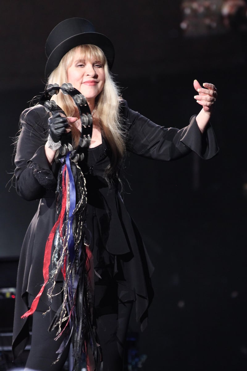 Stevie Nicks now often sports all-black ensembles adorned with ribbons, frills and trims