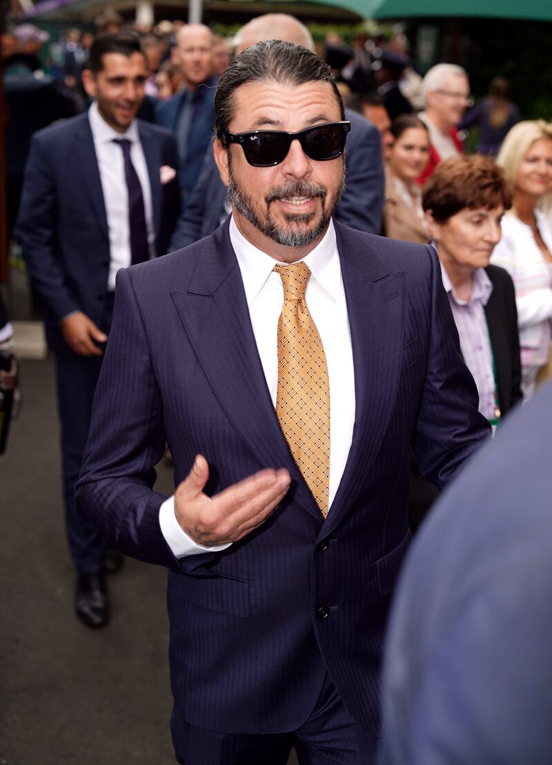 Dave Grohl mingles with onlookers as he arrives at Wimbledon