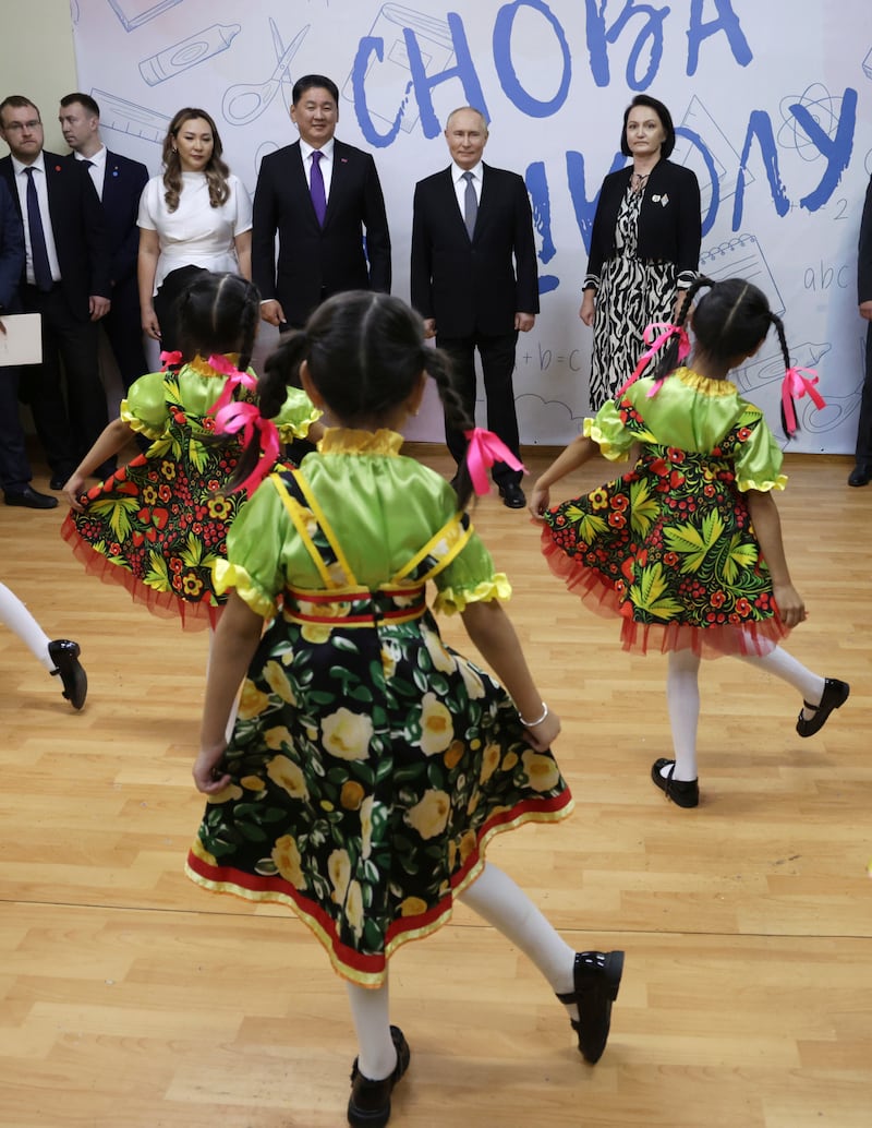 Russian President Vladimir Putin and Mongolian President Ukhnaagiin Khurelsukh visit a school of the local branch of Plekhanov Russian University of Economics in Ulaanbaatar, Mongolia (Vyacheslav Prokofyev, Sputnik, Kremlin Pool Photo via AP)