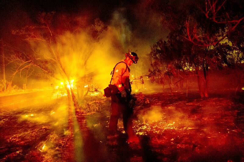 Firefighters increased their containment of a large wildfire in California (Noah Berger/AP)