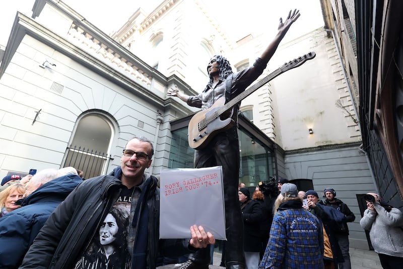 A commemorative statue of legendary composer and musician Rory Gallagher was revealed today at Ulster Hall, honouring his life, music, and his deep connection to Belfast. 
Crafted by renowned sculptors Anto Brennan, Jessica Checkley of Bronze Art Ireland, and David O’Brien of Bronze Art Ireland. It is inspired by a January 1972 Melody Maker magazine cover shot of Rory onstage at Ulster Hall. PICTURE: MAL MCCANN