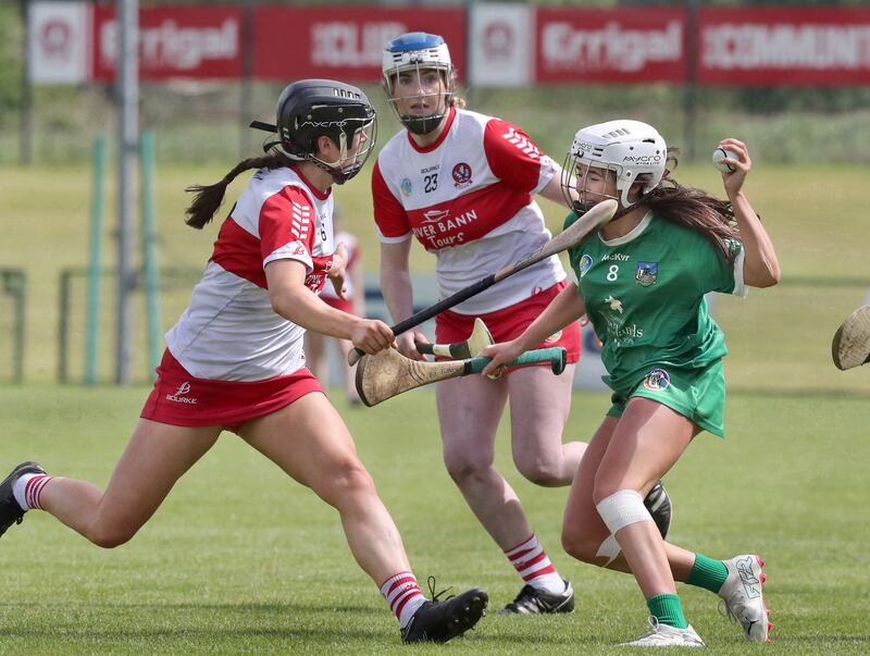 Derry's Megan Donnelly with Orlaith Kelleher of Limerick during the All Ireland Senior Camogie Championship match at Owenbeg 
Picture: Margaret McLaughlin