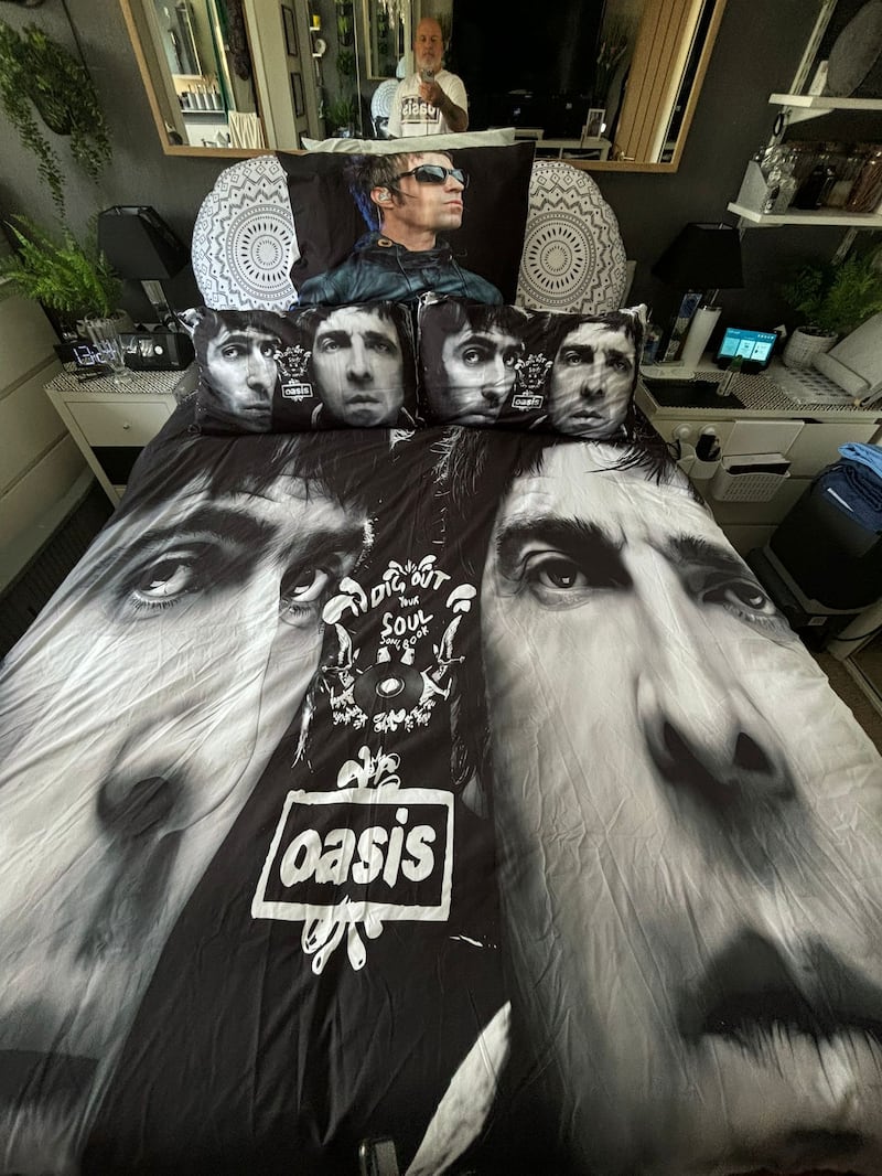 Oasis superfan John Smallbones owns a several duvet covers with Noel and Liam Gallagher’s faces (John Smallbones)