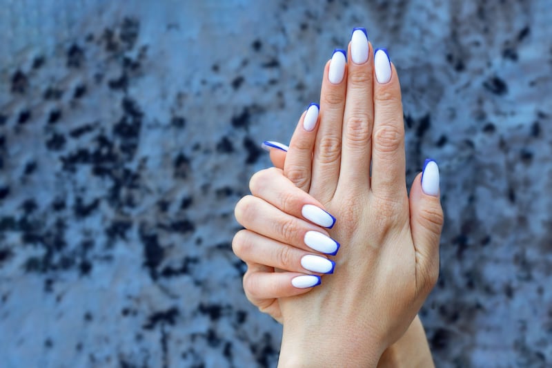 Playing with bold colours on a classic French tip is this summer’s biggest trend