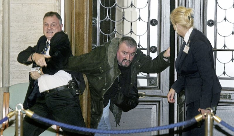 Convicted killer Michael Stone is restrained and disarmed by security staff in Parliament Buildings in 2006. File picture by Mal McCann 