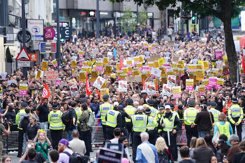 Thousands of counter-protesters demonstrated peacefully on Wednesday night ahead of expected anti-immigration action