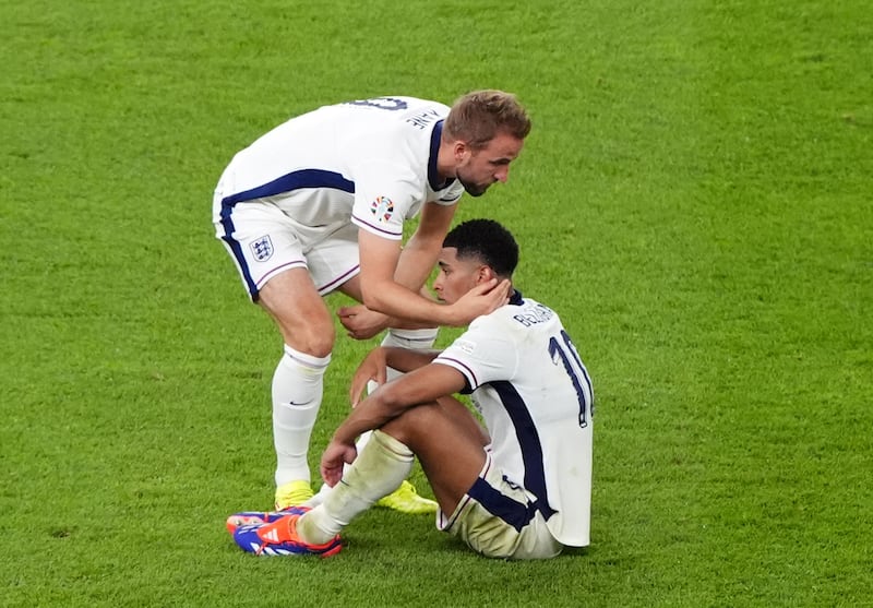 England’s Harry Kane commiserates with Jude Bellingham following England’s defeat