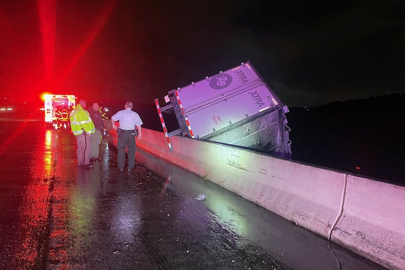 A tractor trailer dangles from a bridge near Tampa, Florida (Florida Highway Patrol/AP)