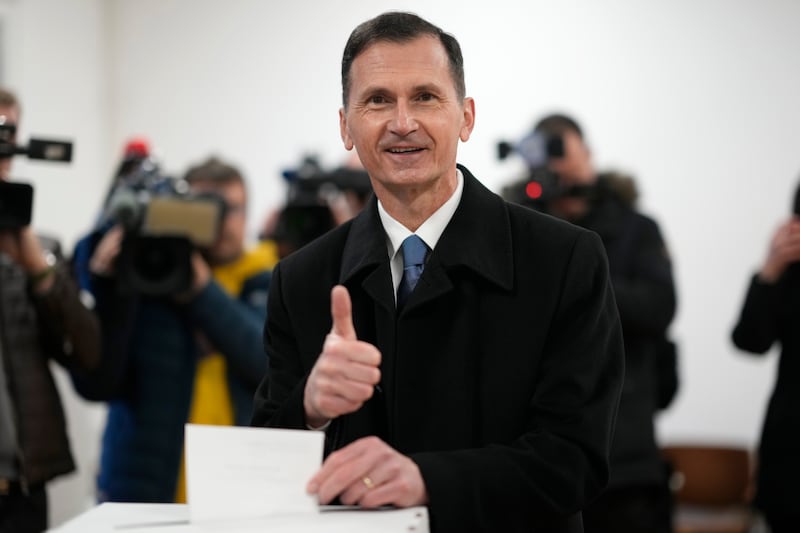 Presidential candidate Dragan Primorac casts his ballot at a polling station in Zagreb (Darko Bandic/AP)