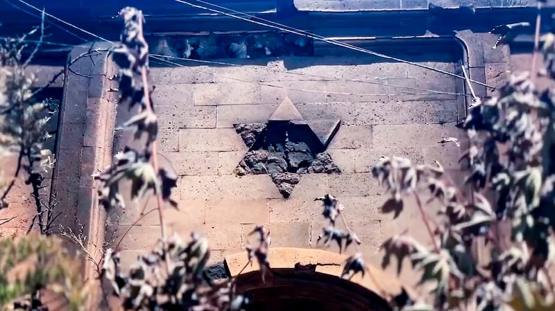 A damaged Star of David on the wall of the the Kele-Numaz synagogue in Derbent (The Telegram Channel of the head of Dagestan Republic of Russia/AP)