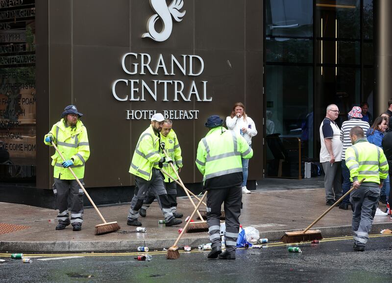 Council cleansing staff clean up following the Twelfth parade through Belfast. Picture by Mal McCann