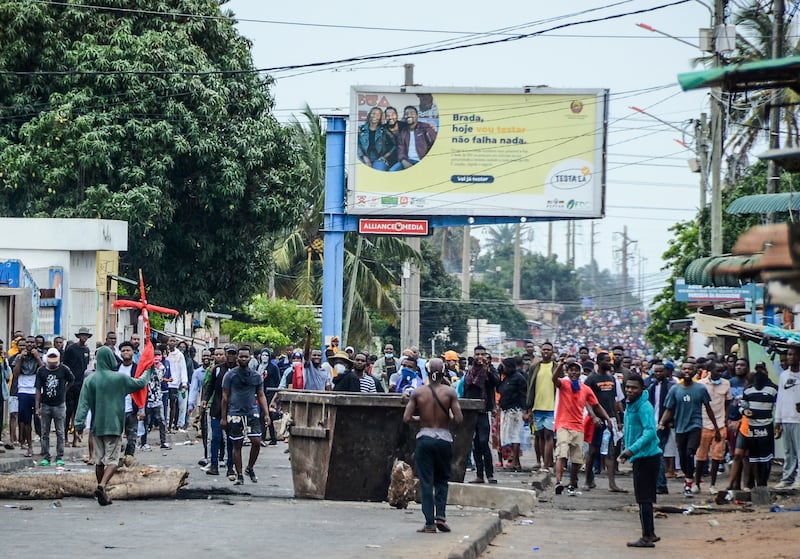 Protesters fill the street in Maputo, Mozambique (Carlos Uqueio/AP)