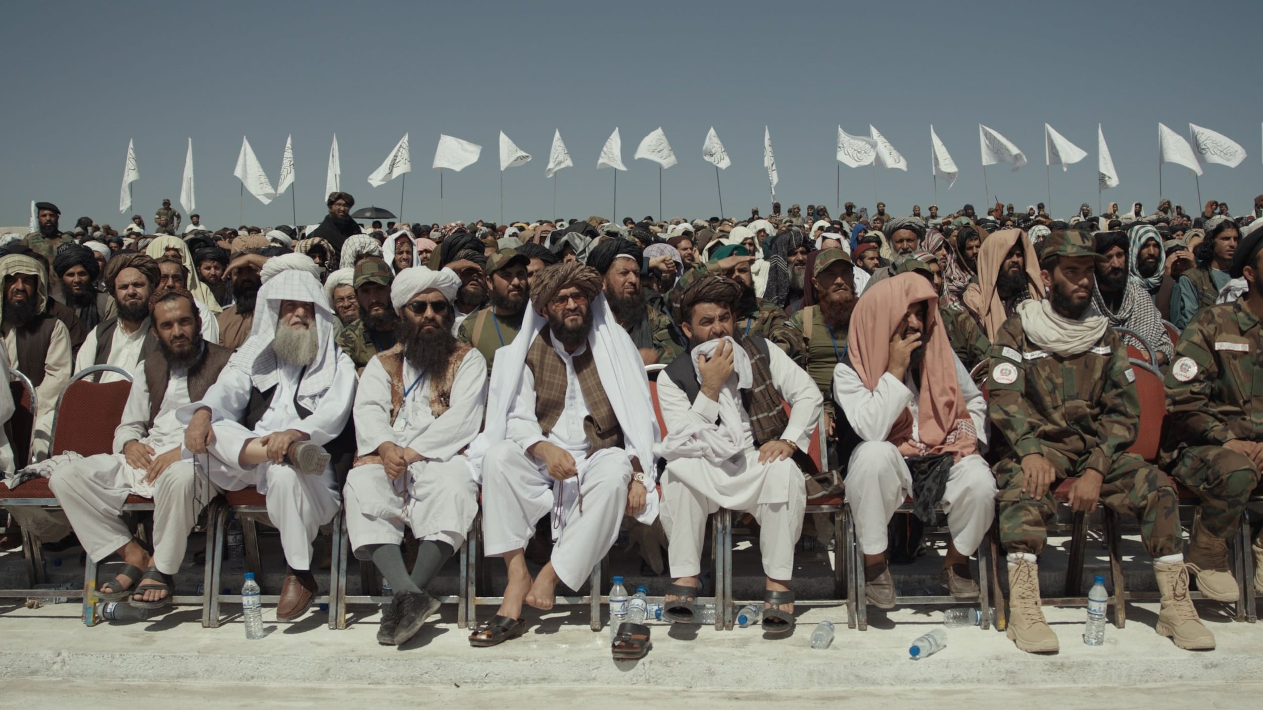 Taliban heirarchy – although they might not accept the term – watching a military parade and fly-by by the Afghan air force
