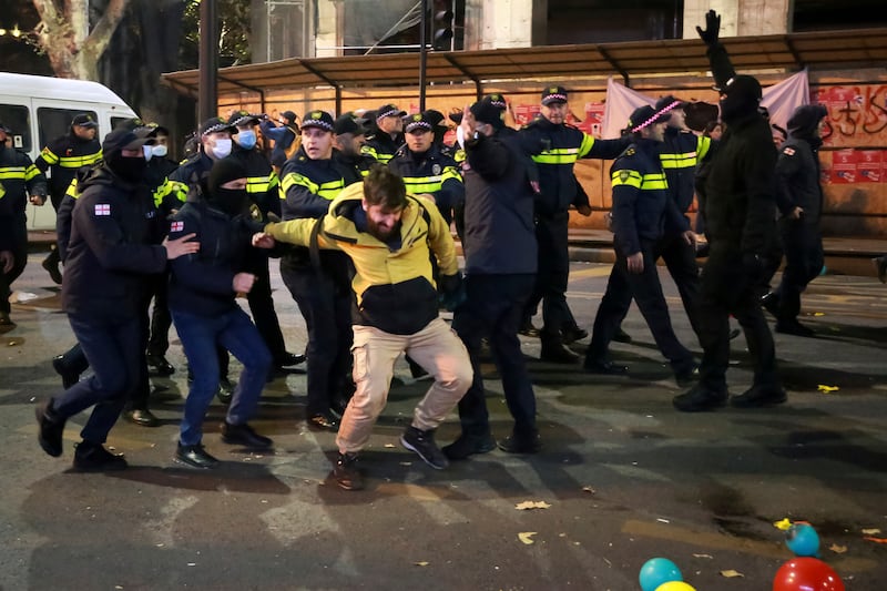 Police detain a protester during a rally against the results of the parliamentary elections amid allegations that the vote was rigged in Tbilisi (Zurab Tsertsvadze/AP)