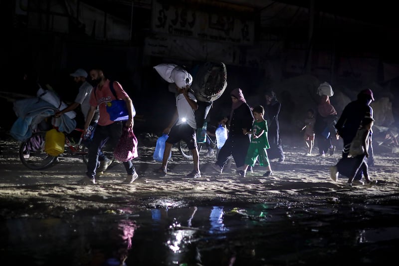 Many families fled their homes in the middle of the night following the evacuation order (AP Photo/Jehad Alshrafi)