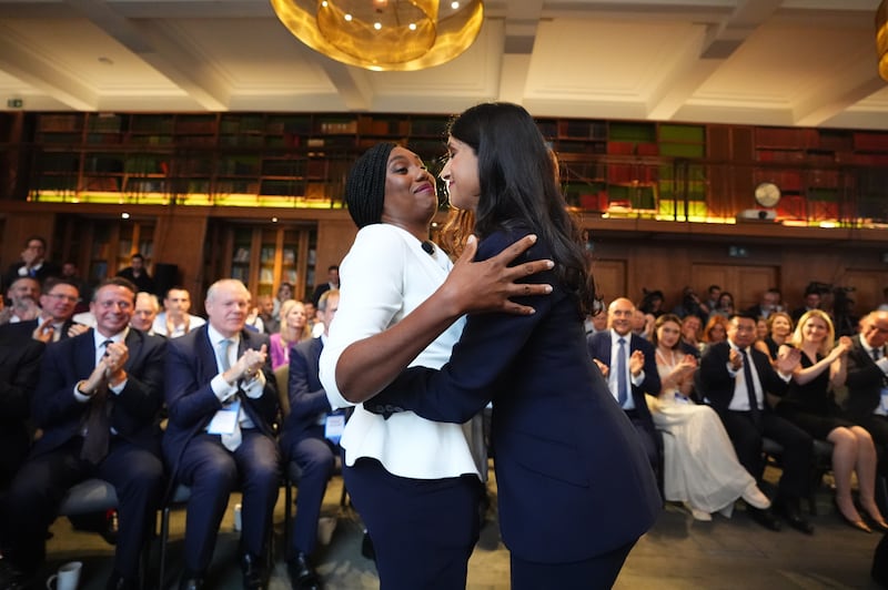 Kemi Badenoch is greeted by Claire Coutinho as she arrives to speak at a Conservative Party leadership campaign event at IET London