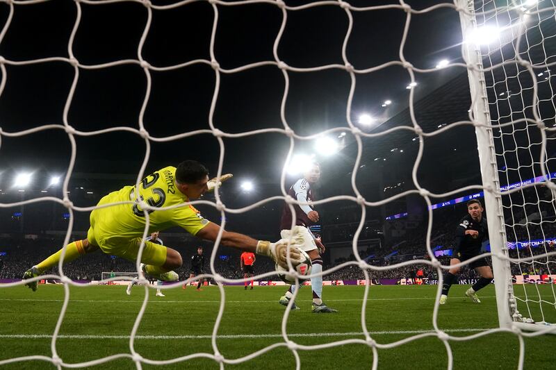 Aston Villa goalkeeper Emiliano Martinez produces a brilliant save