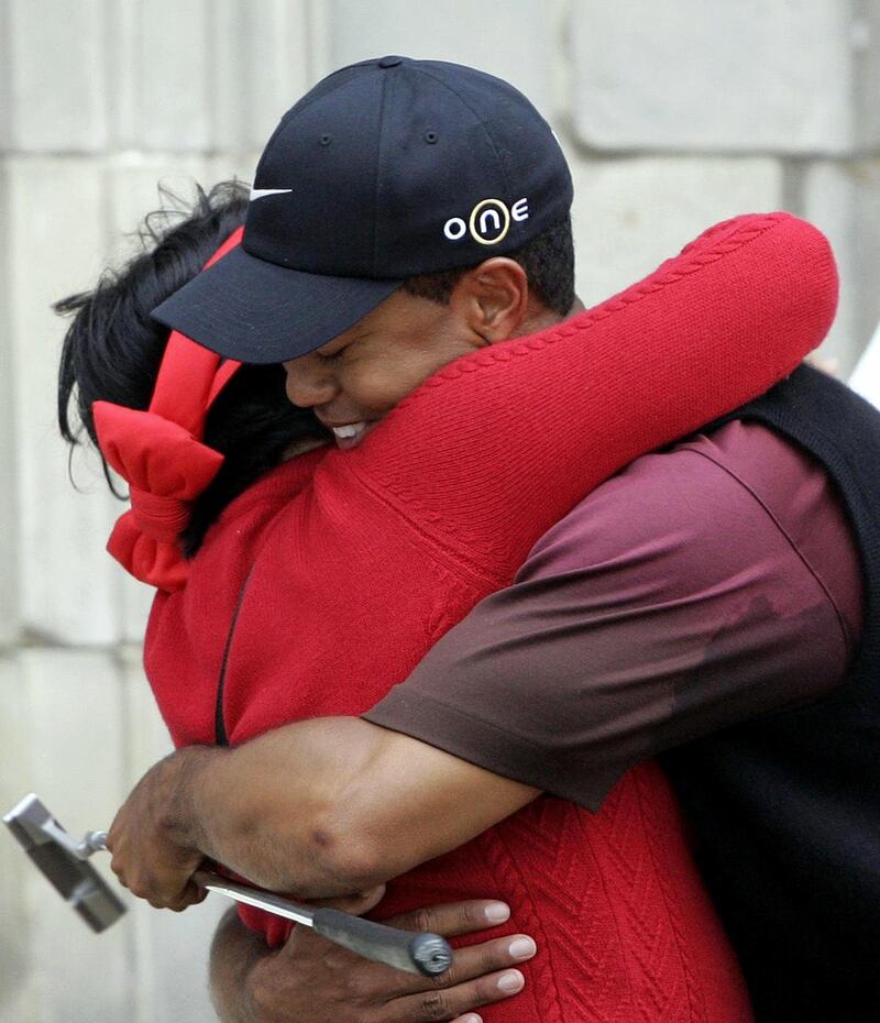 Tiger Woods celebrates with his mother Kultida after winning the 134th Open Championship