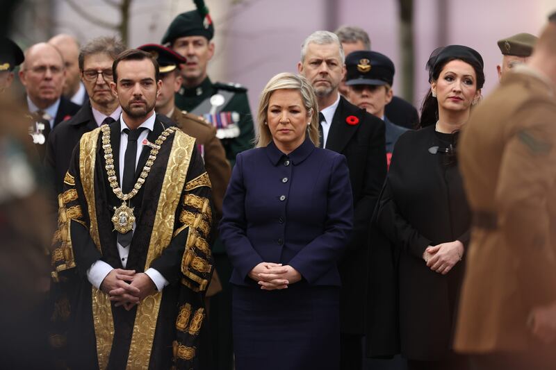 Lord Mayor of Belfast Micky Murray, left to right, First Minister Michelle O’Neill and deputy First Minister Emma Little-Pengelly attended the Remembrance Sunday service at Belfast City Hall in November