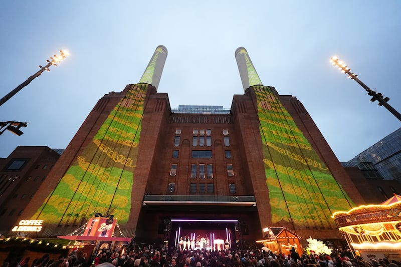 Schoolchildren’s artwork projected onto the chimneys of Battersea Power Station