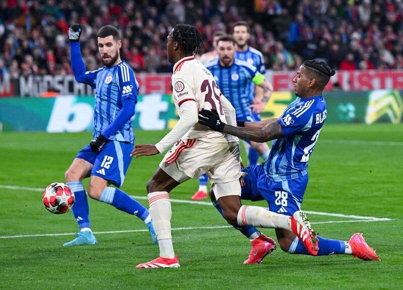 Mathys Tel, centre, is to undergo a medical at Tottenham (Sven Hoppe/dpa via AP)