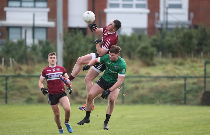 St Mary’s Darragh  Treanor  and Queen’s  Brian Conway during Sundays Sigerson Cup game at Davitt Park in Belfast.
PICTURE COLM LENAGHAN