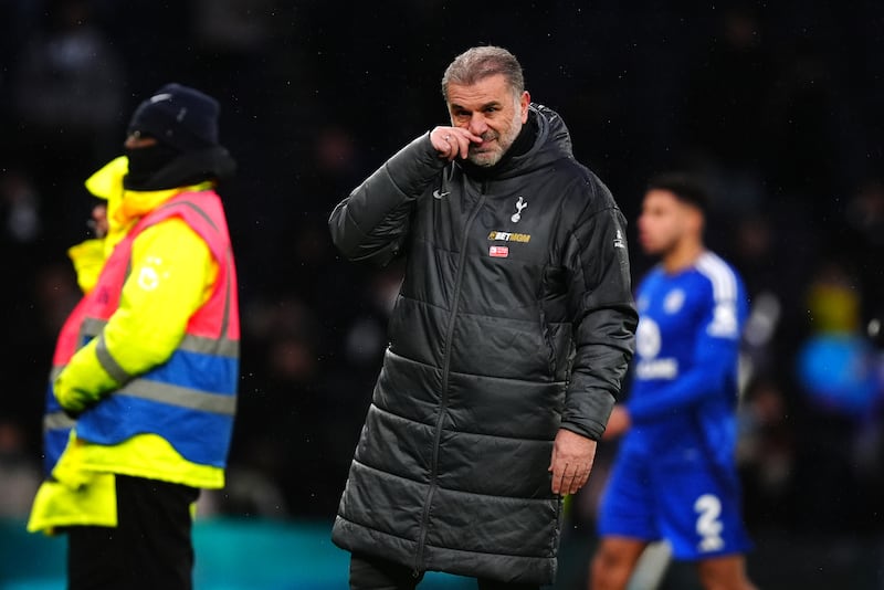 Tottenham boss Ange Postecoglou (left) applauds the fans following the home defeat to Leicester