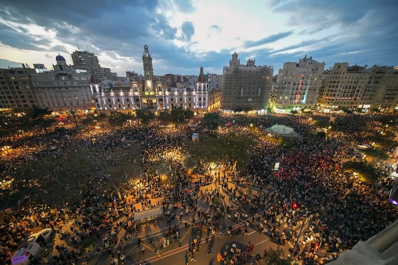 Thousands of demonstrators gathered in front of the city council for a protest (AP)