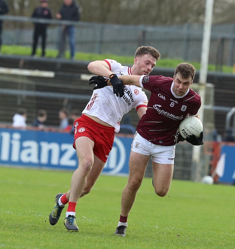 Tyrone's Brian Kennedy and Galway's Paul Conroy in action