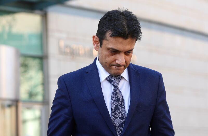 Dr Rohit Sharma leaves  Laganside Court in Belfast, after giving evidence in the Baby Troy Brady inquest.
PICTURE COLM LENAGHAN