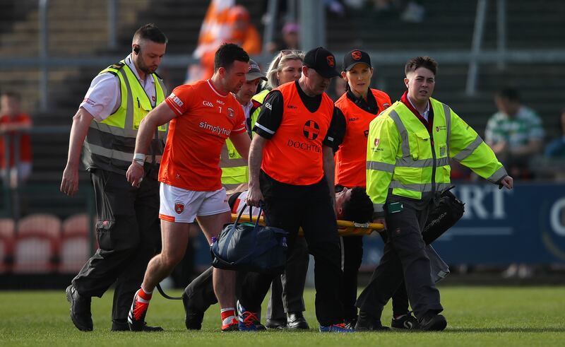 Armagh skipper Aidan Forker consoles Conor O'Neill as he exits the pitch with a ruptured Achilles Tendon.
Mandatory Credit ©INPHO/Leah Scholes
