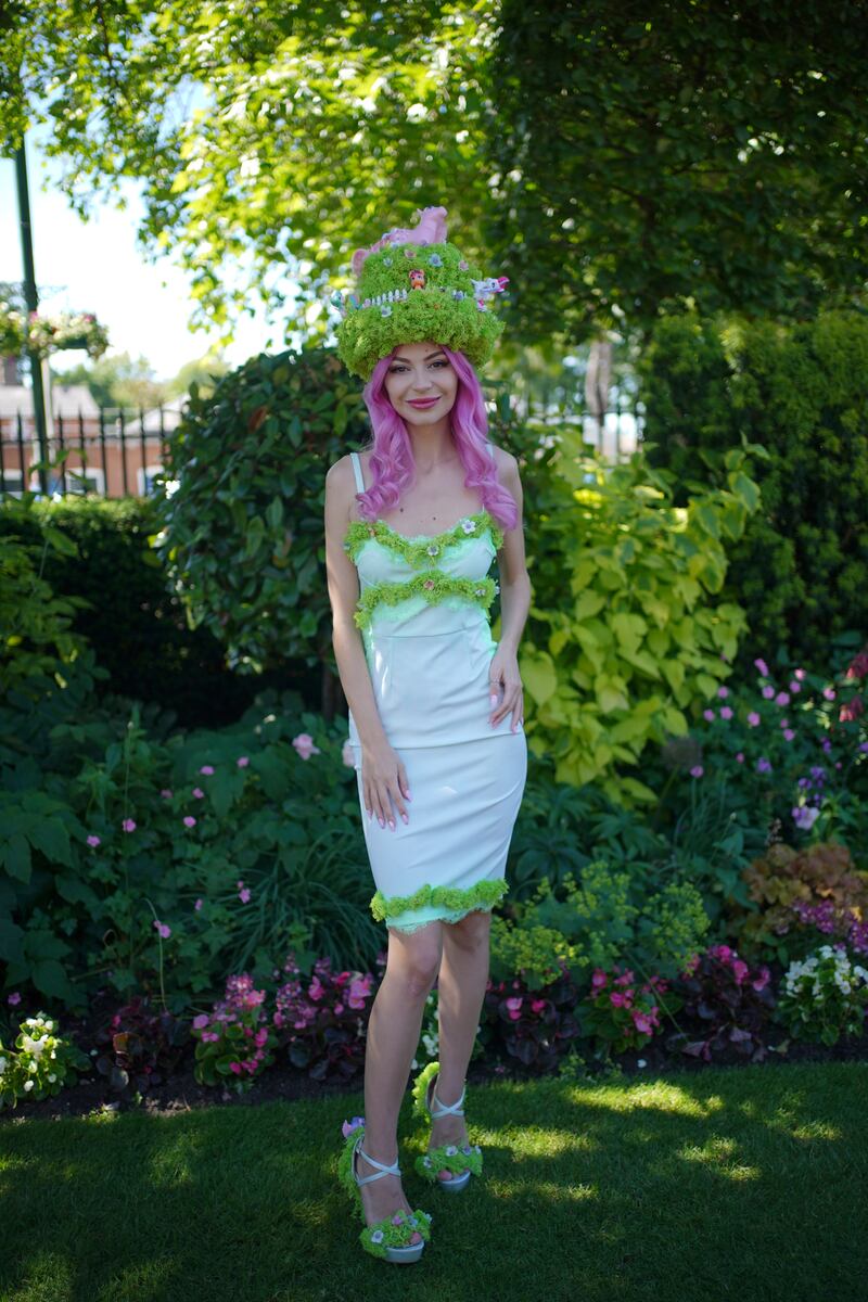 YouTuber Julia Zelg wears custom garden dress with faux grass trim and farm figurines (Yui Mok)