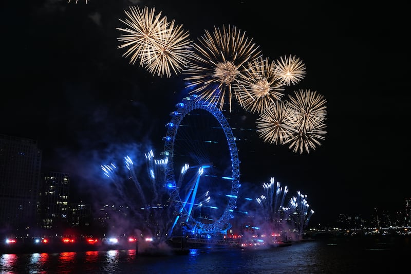 Fireworks light up the sky over the London Eye