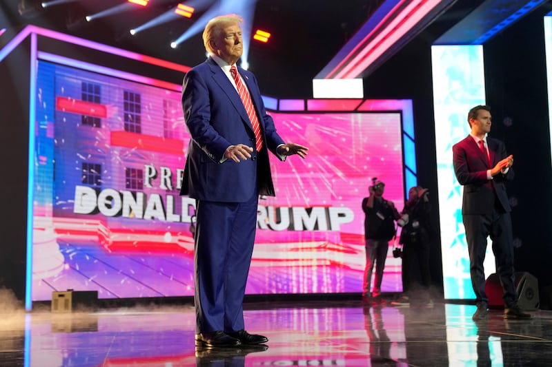 President-elect Donald Trump arrives to speak at AmericaFest in Phoenix, Arizona (Rick Scuteri/AP)