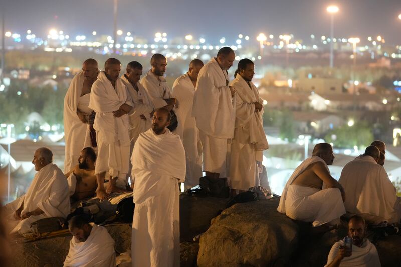 Pilgrims at the top of the Mountain of Mercy (Rafiq Maqbool/AP)