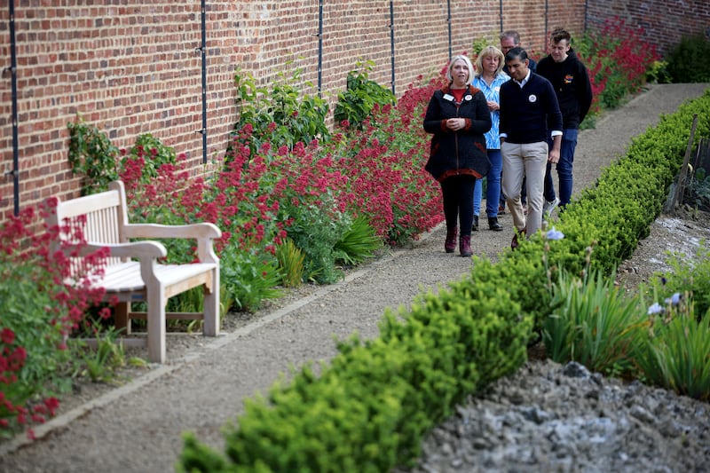 Prime Minister Rishi Sunak tours the gardens during a visit to the Big Help Out project in Bishop Auckland