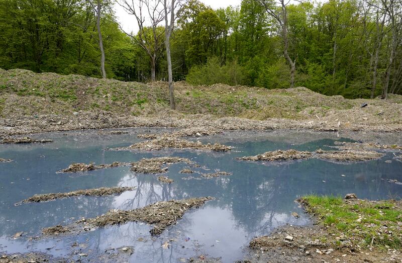 Blue water at Hoad’s Wood where thousands of tonnes of illegal waste has been dumped.