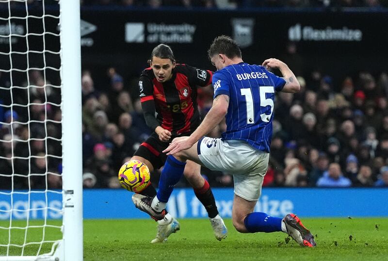 Enes Unal, left, scores Bournemouth’s equaliser