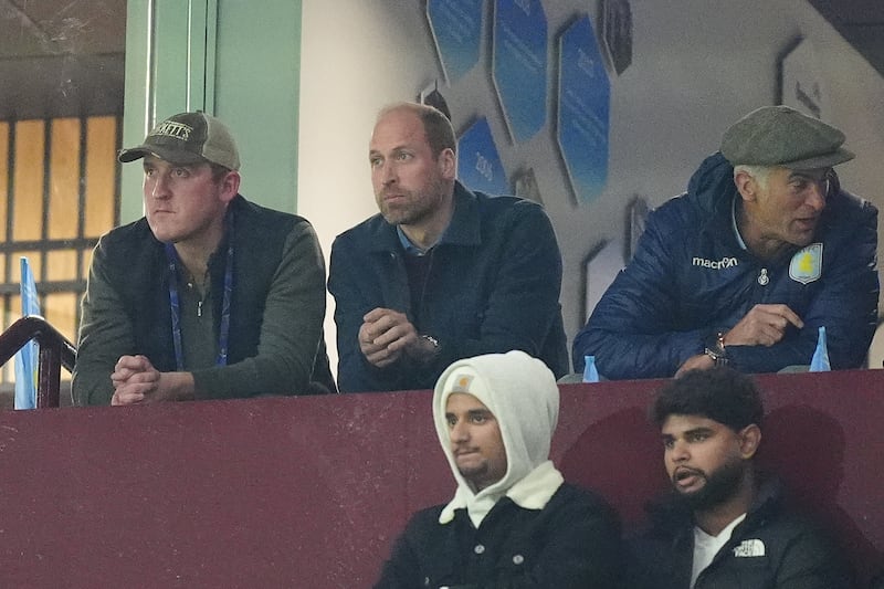 The Prince of Wales (centre) in the stands during the UEFA Champions League match at Villa Park, Birmingham