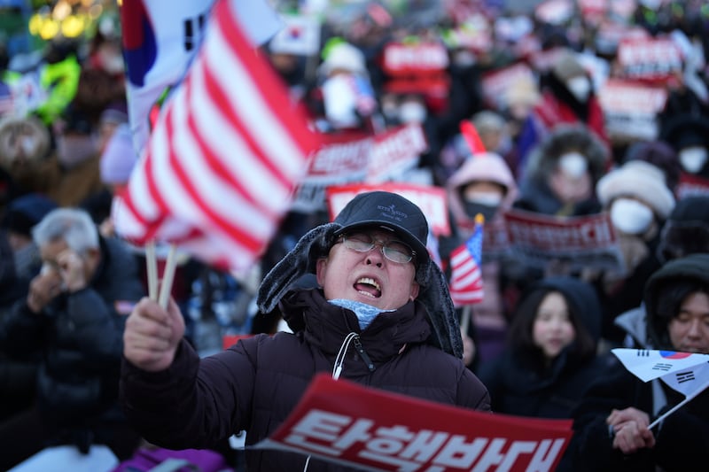 Supporters of impeached South Korean President Yoon Suk Yeol stage a rally to oppose a court warrant for his arrest (Lee Jin-man/AP)