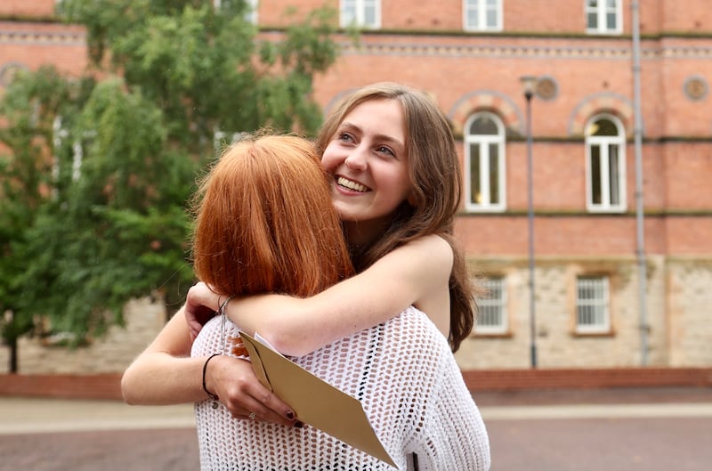 From L-R Olivia Napier and Blaithin Drain from St Dominic’s in West Belfast receive their A level results. PICTURE COLM LENAGHAN