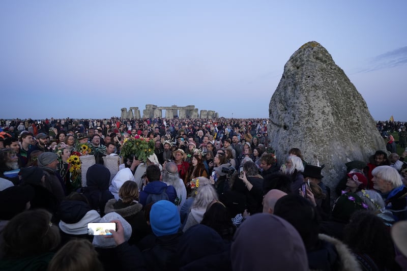 Crowds at Stonehenge in Wiltshire during sunrise
