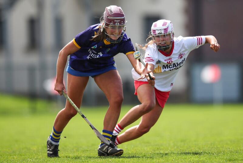 Tyrone's Lára Devlin tackles Ciara Wafer of Wicklow during the Very Camogie League Division 4 Final in Darver, Co Louth