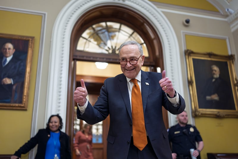 Chuck Schumer celebrates as the Senate begins voting on the government funding bill just in time to meet the midnight deadline (AP Photo/J. Scott Applewhite)