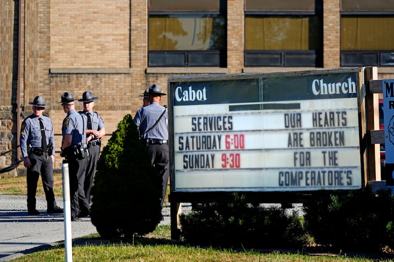 Pennsylvania State Police arrive at the Cabot Church (Gene J Puskar/AP)