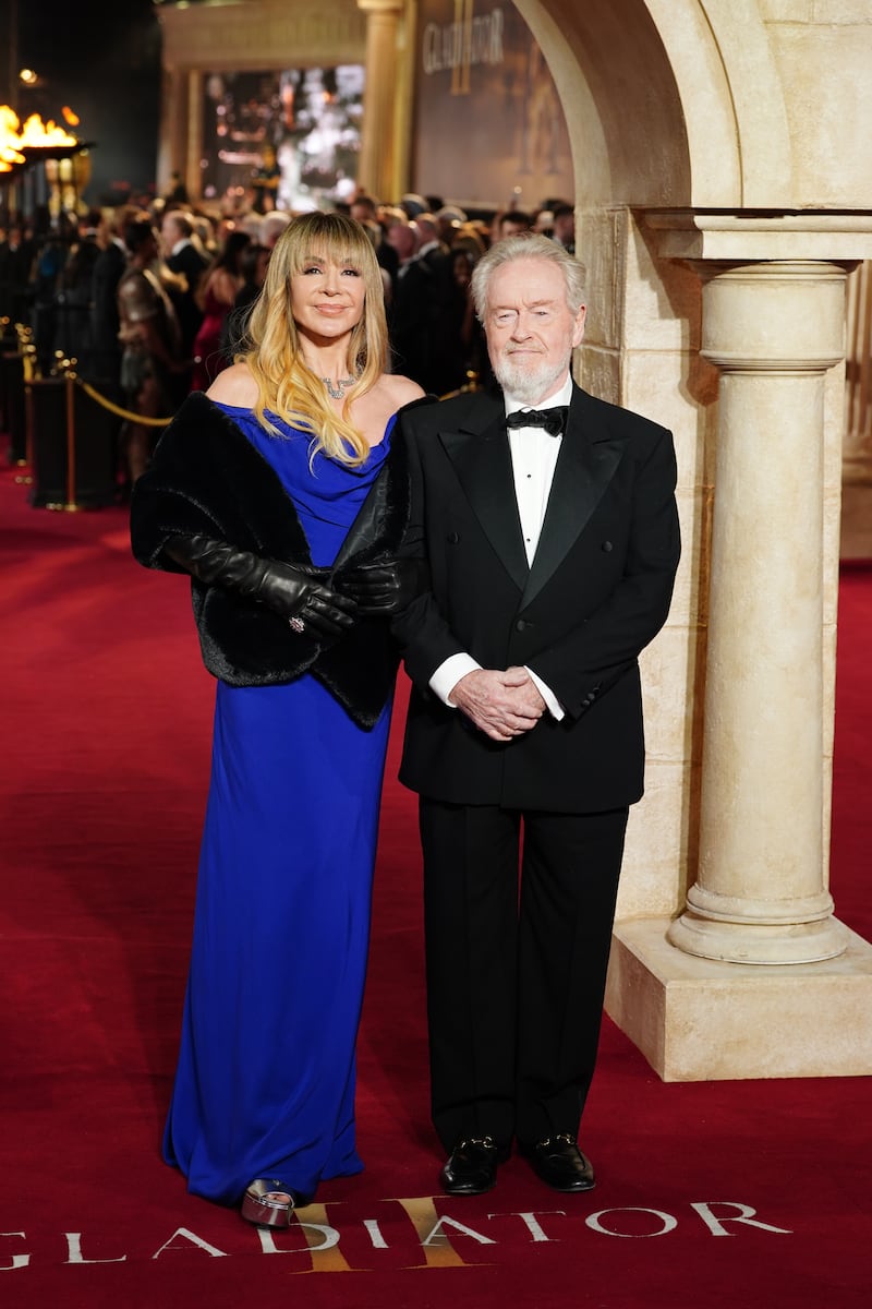 Giannina Facio and Ridley Scott sported classic black tie