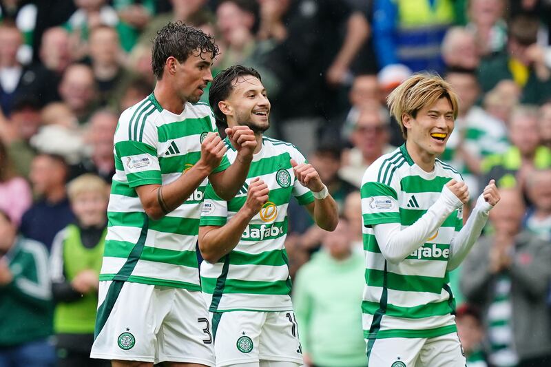 Nicolas Kuhn, centre, celebrates with team-mates