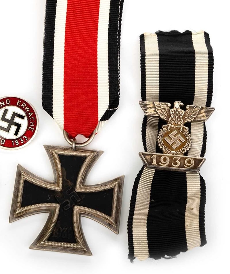 An Iron Cross medal and a Nazi ribbon went under the hammer