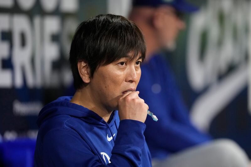 Los Angeles Dodgers designated hitter Shohei Ohtani’s interpreter Ippei Mizuhara stands in the dugout at the Gocheok Sky Dome in Seoul (Lee Jin-man/AP)
